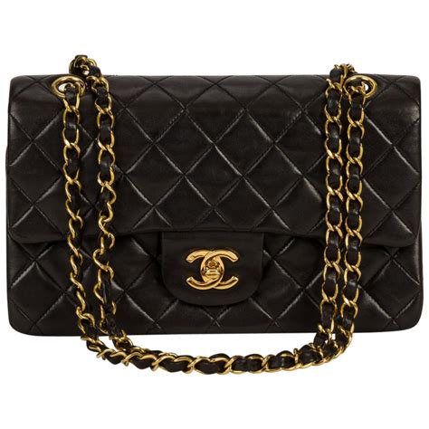 black chanel bag with gold ribbon|Chanel black classic flap bag.